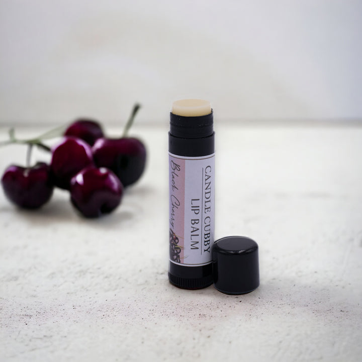 Black Cherry Lip Balm, Classic Tube, Black Cherry Flavored, Candle Cubby, Countertop Photo with Fruit in Background