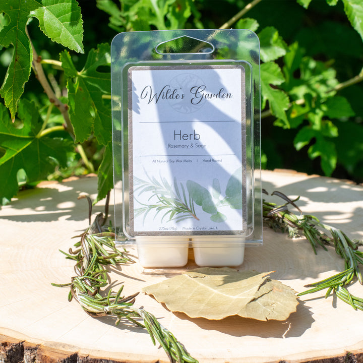Herb, Scented Wax Melts, Rosemary and Sage Scented, Wilde's Garden, Photo on Log with Rosemary and Sage Leaves