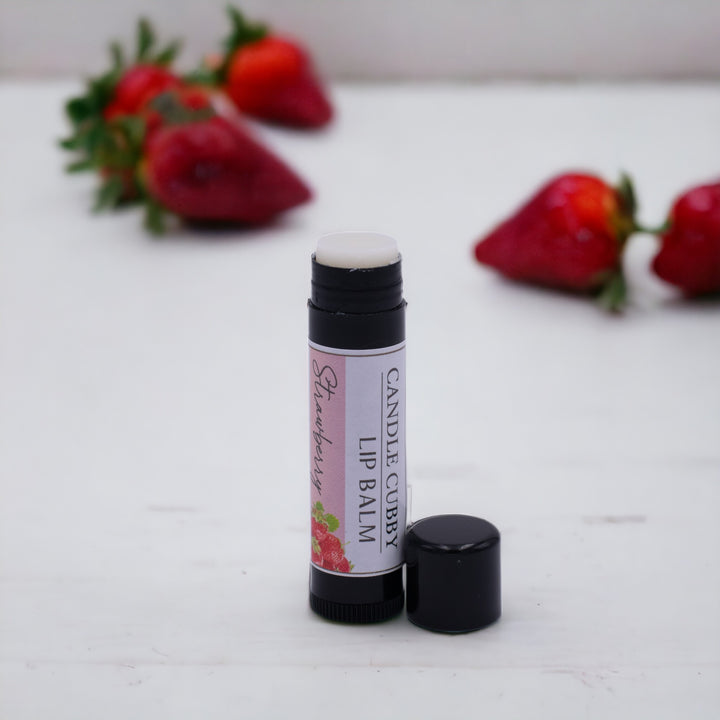 Strawberry Lip Balm, Classic Tube, Strawberry Flavored, Candle Cubby, Countertop Photo with Fruit in Background