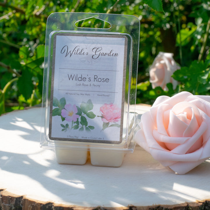 Wilde's Rose, Scented Wax Melts, Lush Rose and Peony Scented, Wilde's Garden, Plain White Background, Outside Photo on Log with Roses