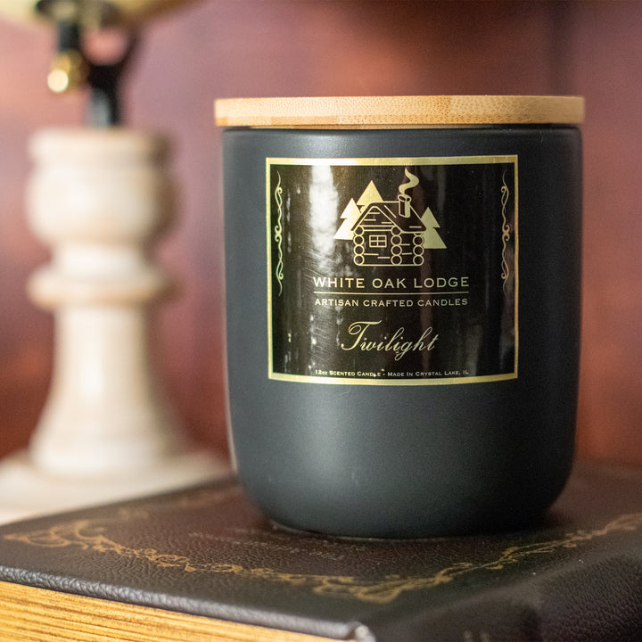 Twilight, 12oz Jar Candle, Lavender and Musk Scented, Front View on Books
